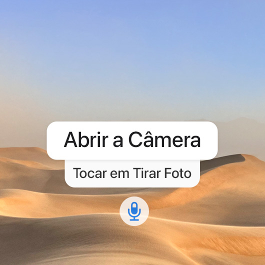 Imagem de uma sequência de comandos de voz: “Abrir a câmera” e “Tocar em Tirar Foto” na interface do Controle por Voz.