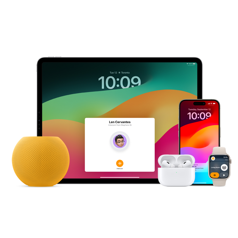 Yellow HomePod mini, an iPad, AirPods in a case, an iPhone and an Apple Watch with a pink band are arranged.