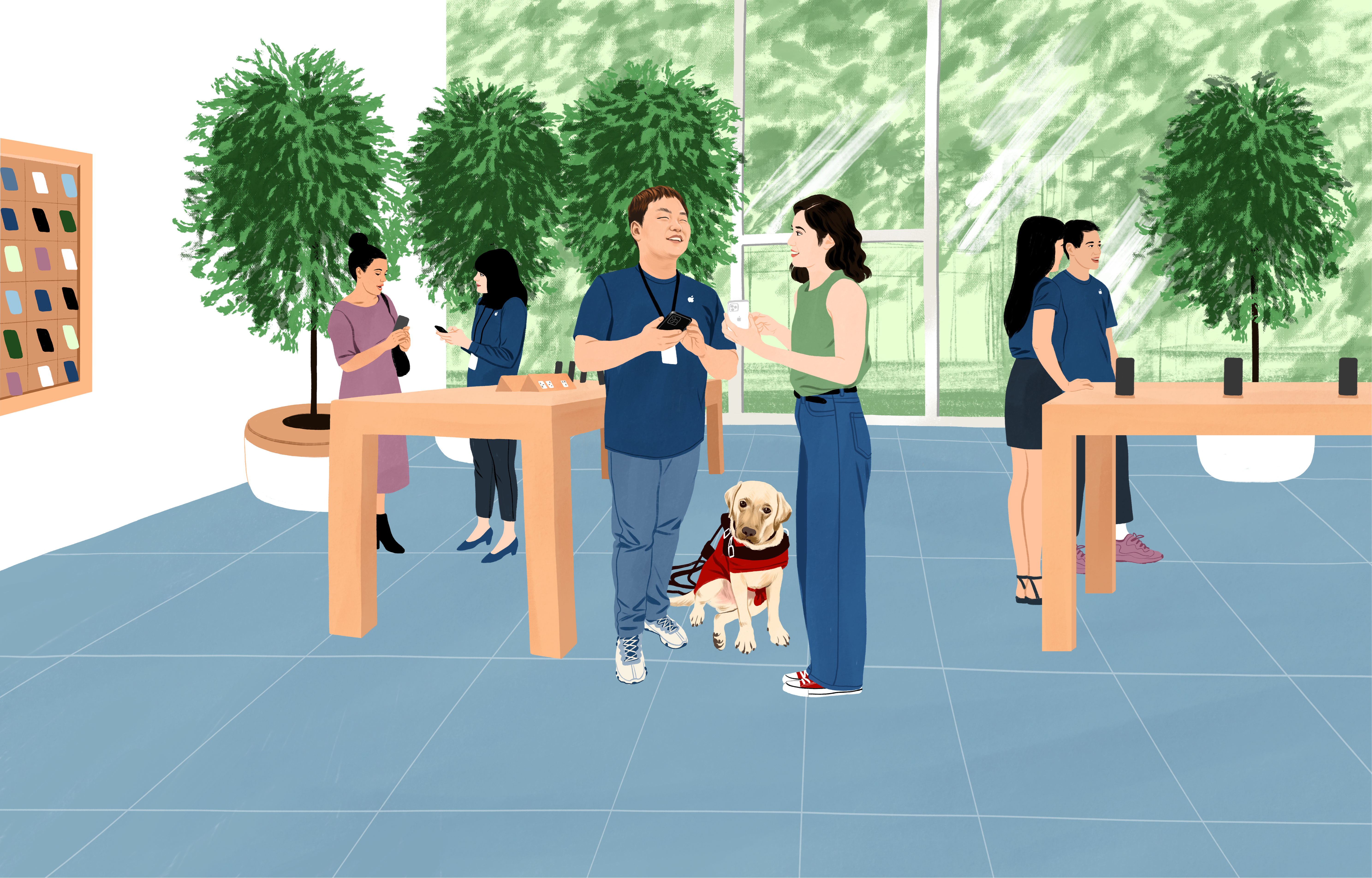 Apple Storeで働くウィリアムがiPhoneを手に、お客さまから質問を受けている。彼の傍には盲導犬が座っている。