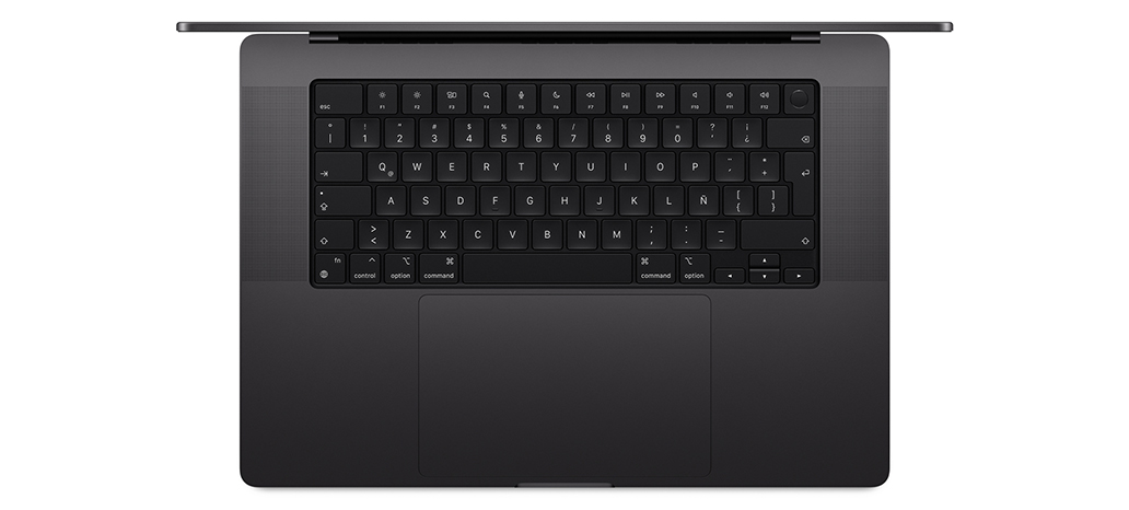 Vista desde arriba de un MacBook Pro que muestra el Magic Keyboard integrado con Touch ID y trackpad