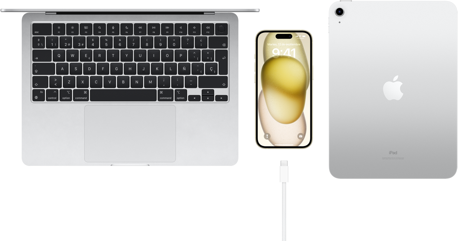 Vista superior de un MacBook Pro, un iPhone 15 con conector USB-C y un iPad
