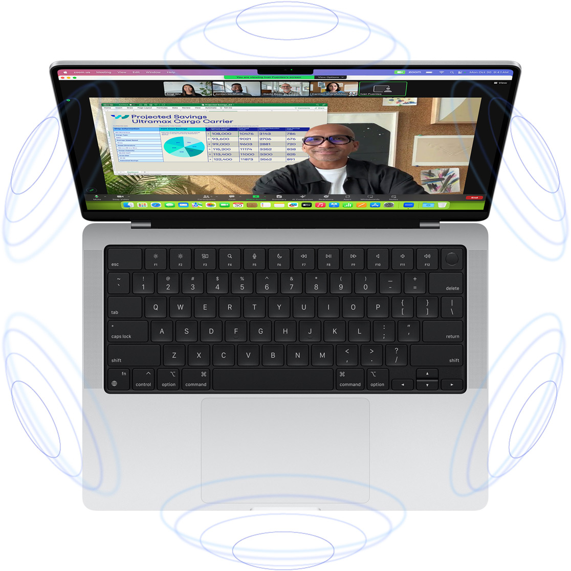 Videochamada FaceTime no MacBook Pro, rodeado de ilustrações de círculos azuis que sugerem a sensação de 3D do Áudio Espacial