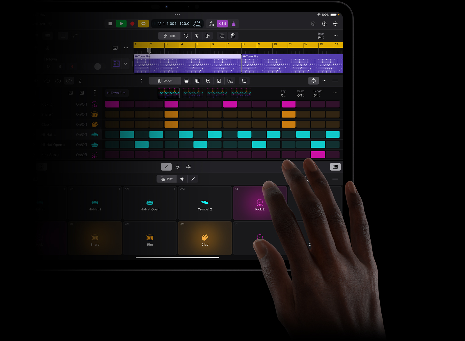 Hand touching an iPad Pro screen to create sound beats in Logic Pro for iPad on iPad Pro