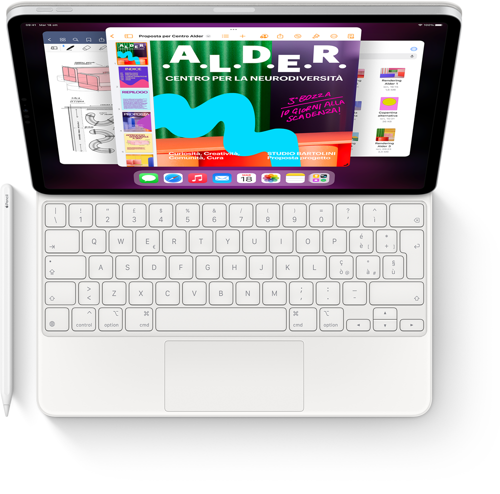 Vista dall’alto di un iPad Pro con Magic Keyboard, Apple Pencil e una serie di app aperte in Stage Manager.