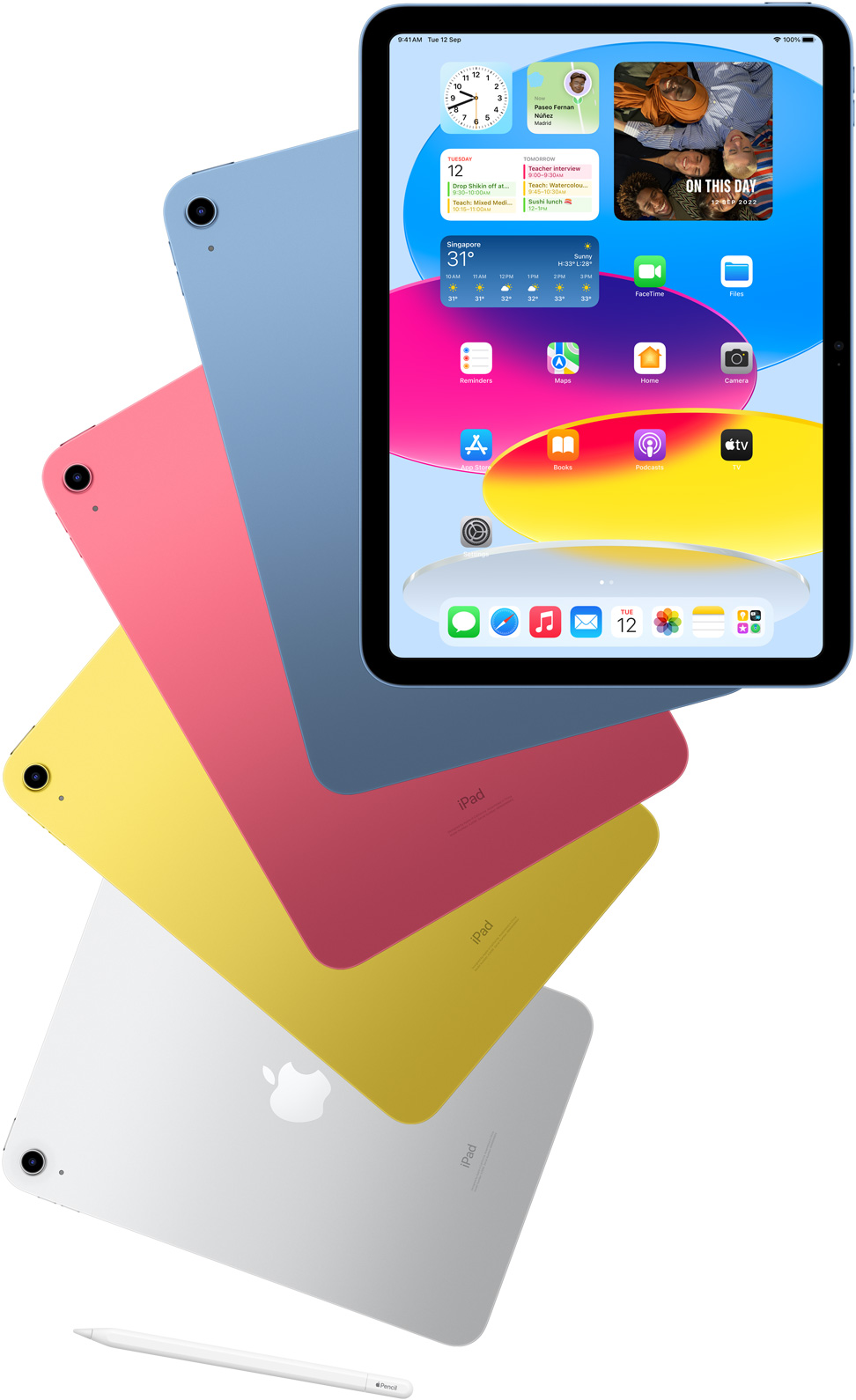 Front-view iPad shows home screen with blue, pink, yellow and silver rear-facing iPads behind it. An Apple Pencil sits near the arranged iPad models.