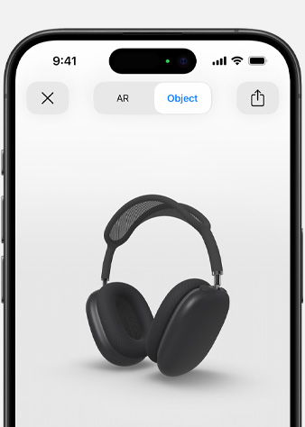 Obraz przedstawia słuchawki AirPods Max w kolorze gwiezdnej szarości w rzeczywistości rozszerzonej na ekranie iPhone’a.
