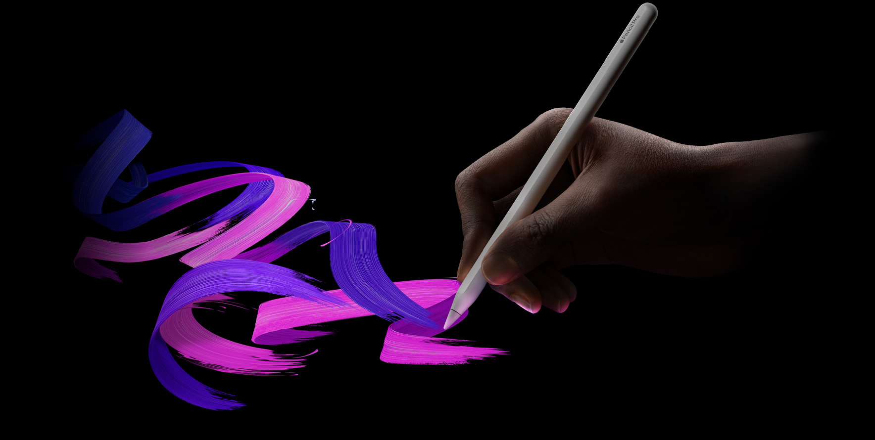 User holding Apple Pencil Pro, a vibrant brush line is following