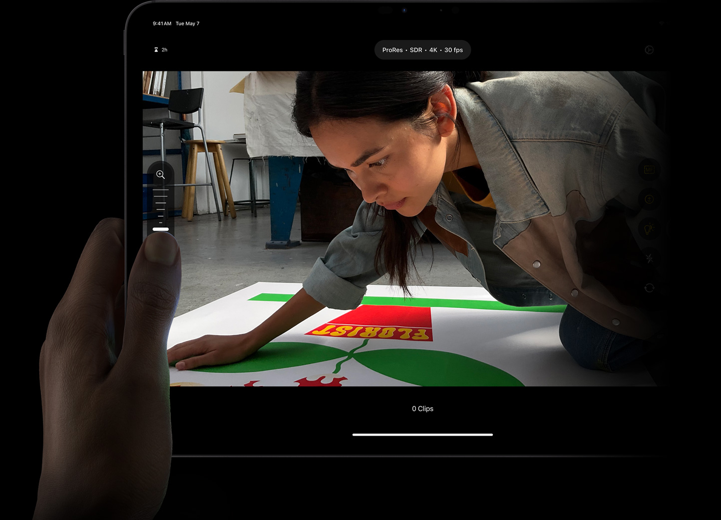 Thumb adjusting focus in ProRes footage using manual pro camera mode controls in Final Cut Pro for iPad on iPad Pro.