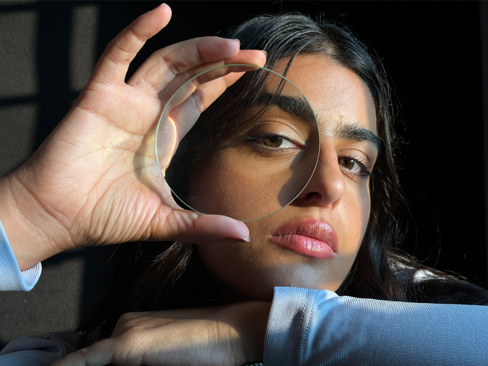 Closeup photo of a women demonstrating 2x Telephoto zoom level