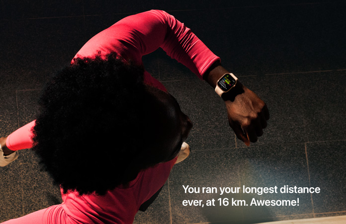 Photo of a man using his Apple Watch to track his run