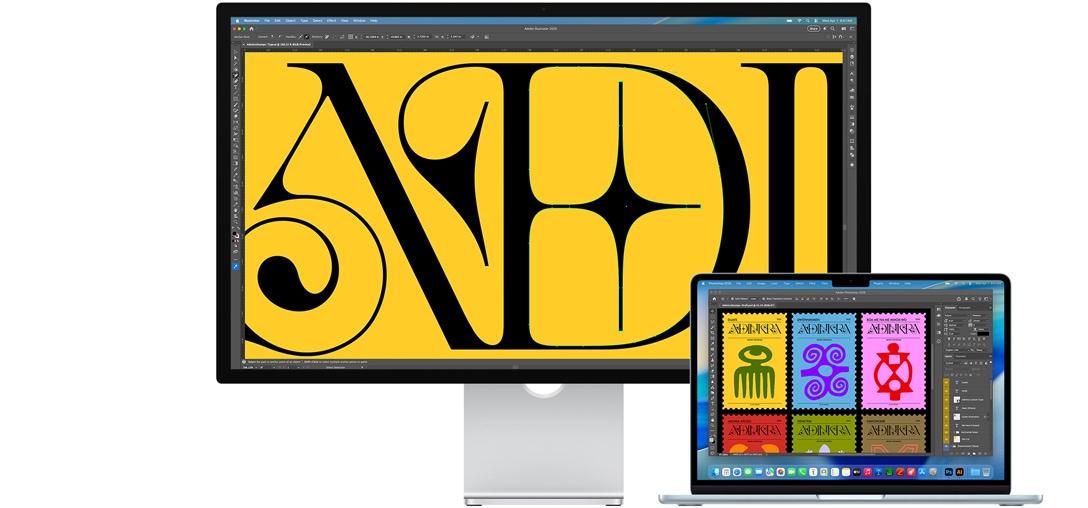 Studio Display и Mac лаптоп, показващ проект, върху който се работи с няколко Adobe програми. Studio Display показва близък план на черен текст на наситен жълт фон, а антирефлексното покритие спомага за намаляване на отблясъците