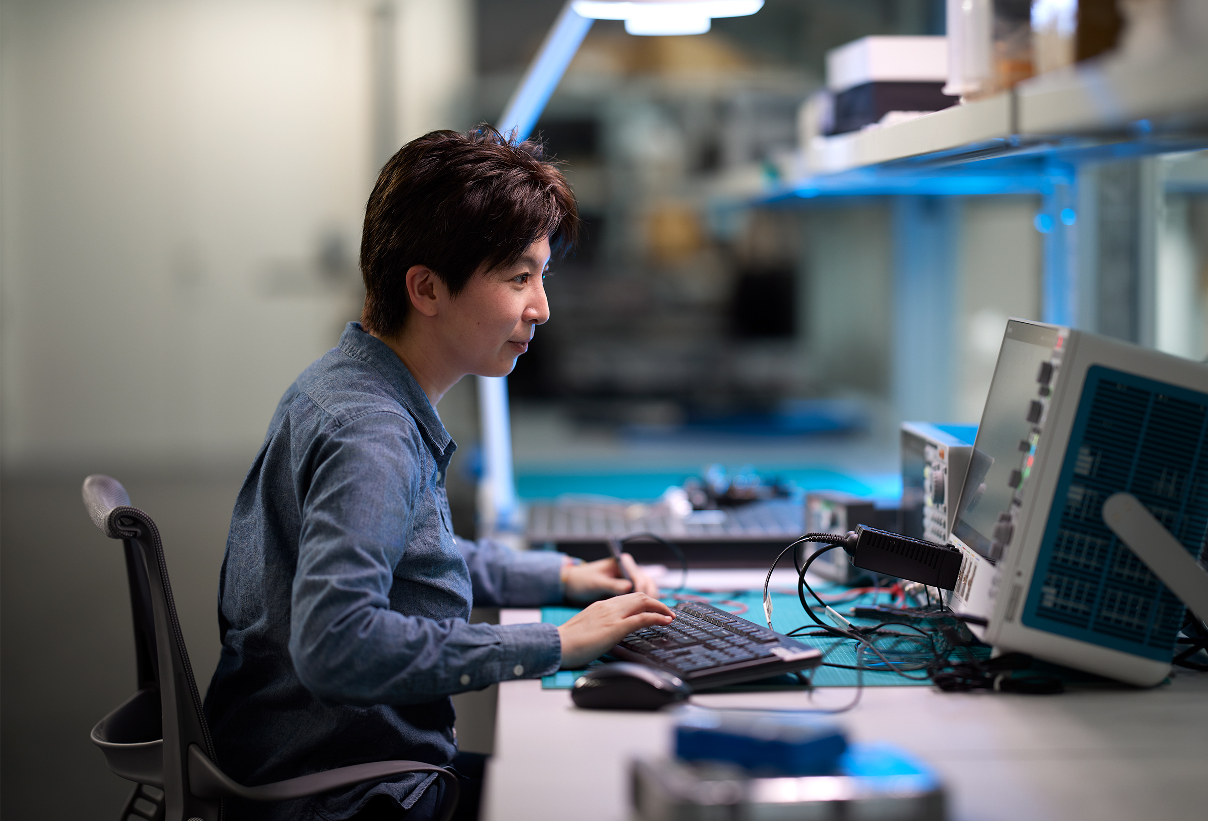 An Apple employee working in a hardware lab.