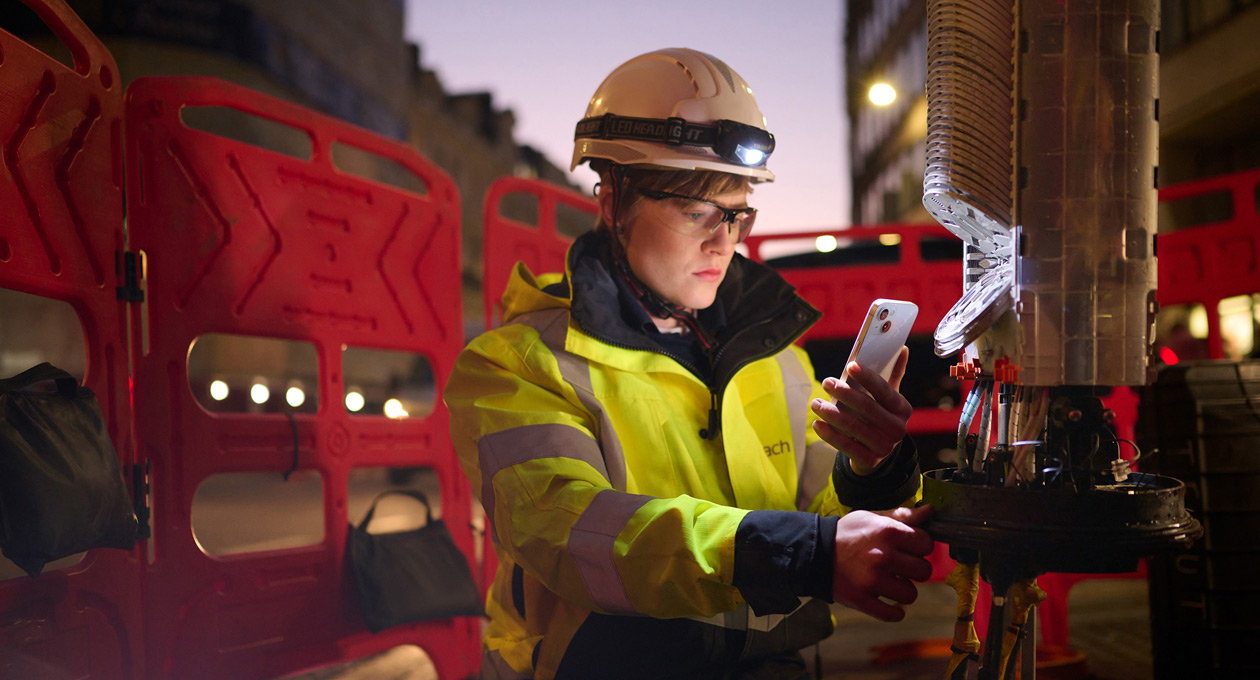 An engineer uses iPhone onsite