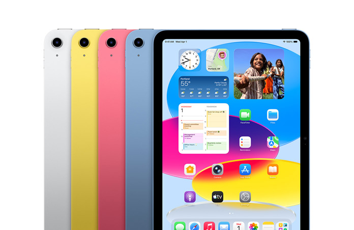 iPad devices lined up in four colours, silver, yellow, pink, blue, while screen shows wallpaper and variety of apps