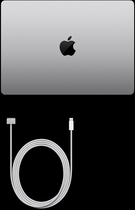 MacBook Pro, silver colour, top, closed, next to charging cable and adapter