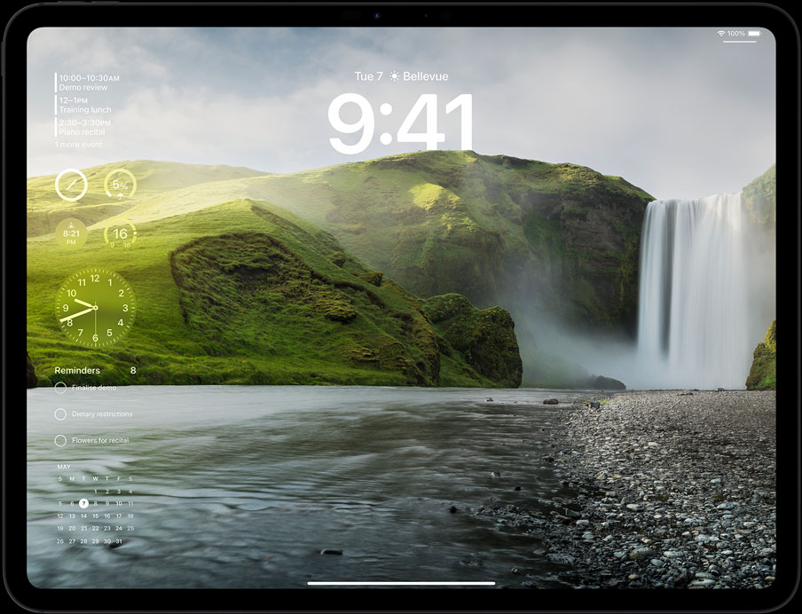 iPad Pro in landscape orientation, screen displaying userʼs lock screen