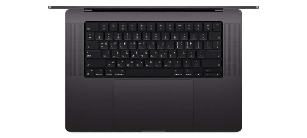 MacBook Pro를 위에서 내려다본 모습. 내장된 Touch ID 및 트랙패드 탑재형 Magic Keyboard가 보입니다.