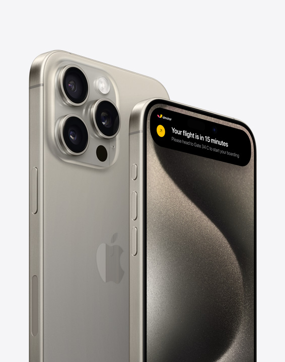 A side-back and side-front view of iPhone 15 Pro. The side-front view displays Dynamic Island in action.