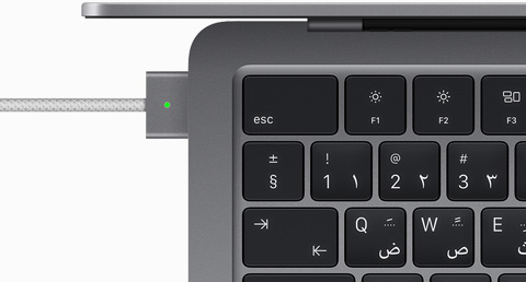 Top view showing MagSafe cable plugged into MacBook Air in Space Gray color