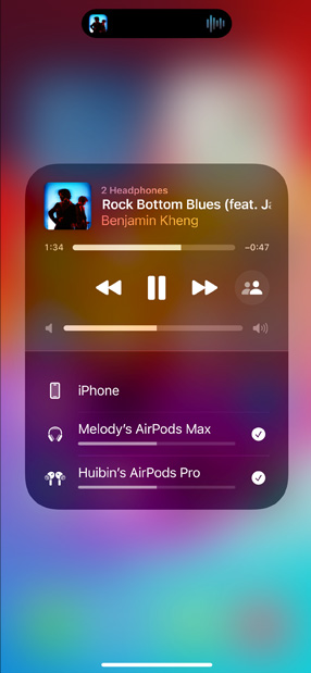iPhone screen displays two sets of AirPods listening to 'All for Nothing (I'm So in Love)' by Lauv.
