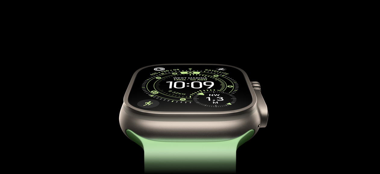 Apple Watch Ultra 3, natural titanium case, compass on Orienteering watch face, neon green Ocean Band