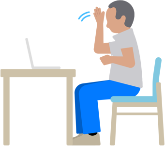 Un hombre usa la lengua de signos con un MacBook