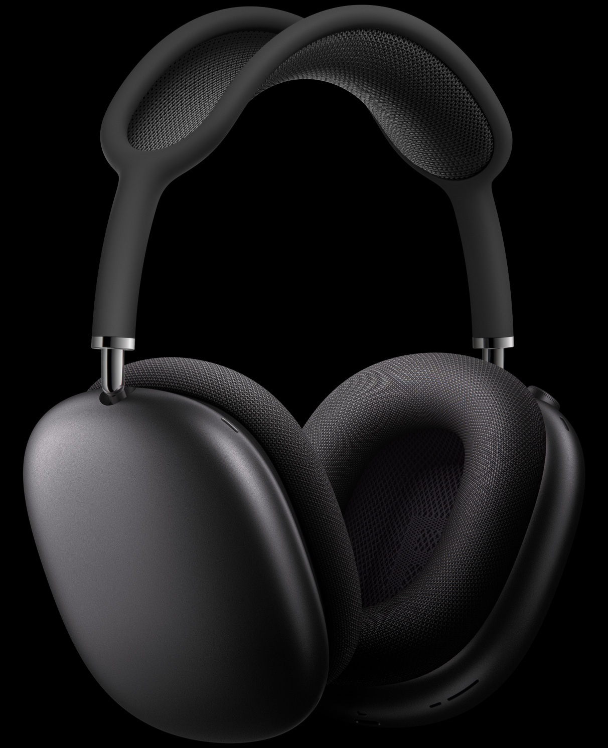AirPods Max in Space Grey at three-quarters perspective, with external microphones relieved into ear cups.