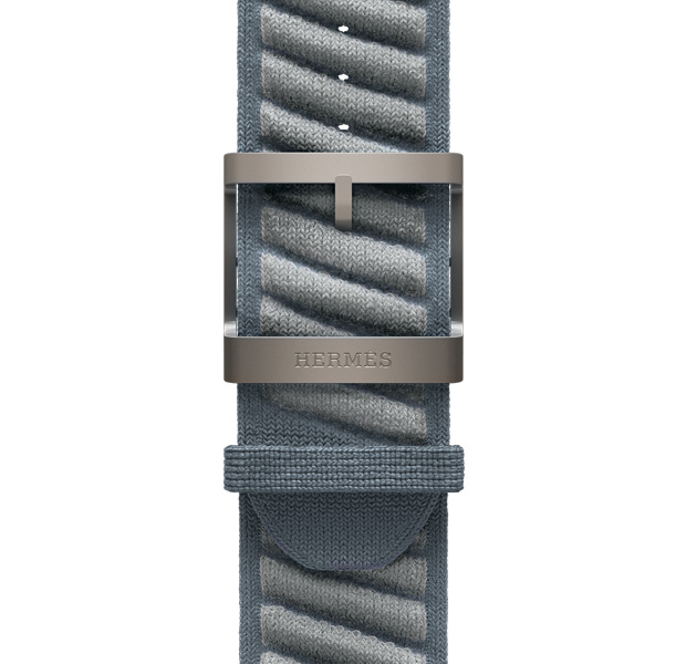 Apple Watch Hermès Ultra 3 En Mer band, bleu gris/bleu glacier colour (blue grey with light grey diagonal textured stripes), knit polyamide yarn material, adjustment holes centred, natural colour titanium buckle engraved with Hermès