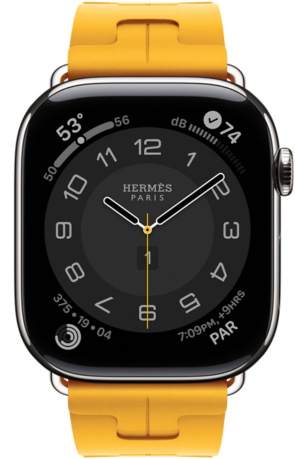 Apple Watch Hermès Series 11, cadran Circulaire (aiguilles des heures, des minutes et des secondes, logo Hermès Paris, complications: Météo, anneaux Activité, heure de Paris et Indice UV), boîtier en titane, argent, côté droit, Digital Crown, associée au bracelet Simple Tour Kilim, jaune (jaune canari), caoutchouc fluoroélastomère