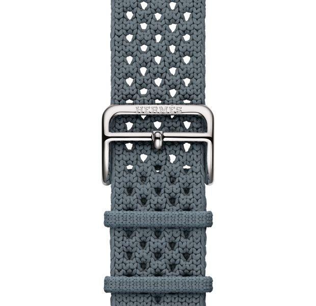Apple Watch Hermès Series 11 Néo Tricot band, bleu gris colour (blue grey), knit polyamide yarn material, adjustment holes centred, silver colour buckle closure engraved with Hermès