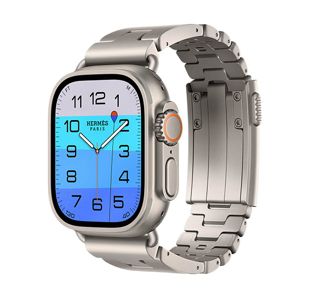 Apple Watch Hermès Ultra 4, cadrans analogiques Fathom et Wonder (aiguilles des heures, des minutes et des secondes, complication Profondeur, avec une personne faisant de la plongée en mer dans un dégradé bleu clair à bleu foncé), boîtier en titane, finition naturelle, côté droit, Digital Crown, bouton latéral en saillie, associée au bracelet Grand H Titane, Gris Titane