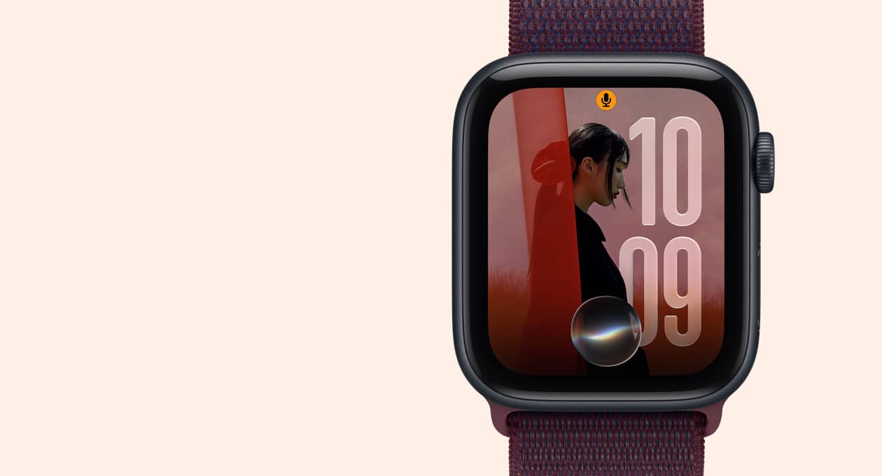 Apple Watch SE 3, aluminium case, midnight colour, screen shows photo image with Siri AI icon bottom centre
