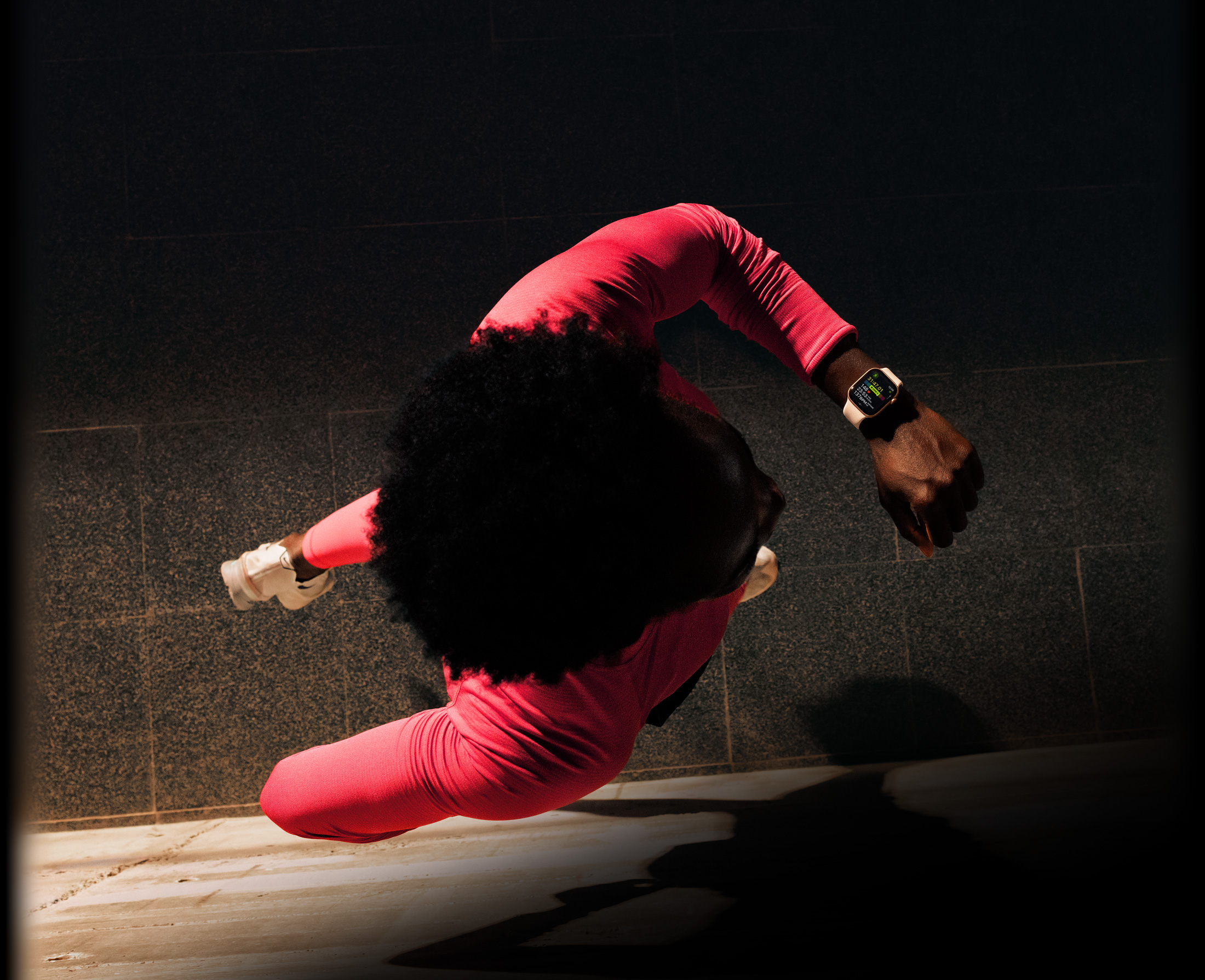 A person checks progress on Apple Watch Series 11 Workout app while running