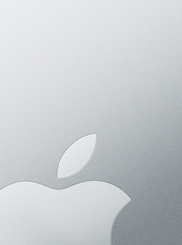 Logotipo branco da Apple sobre um fundo prateado, fazendo referência à tampa do MacBook&nbsp;Air