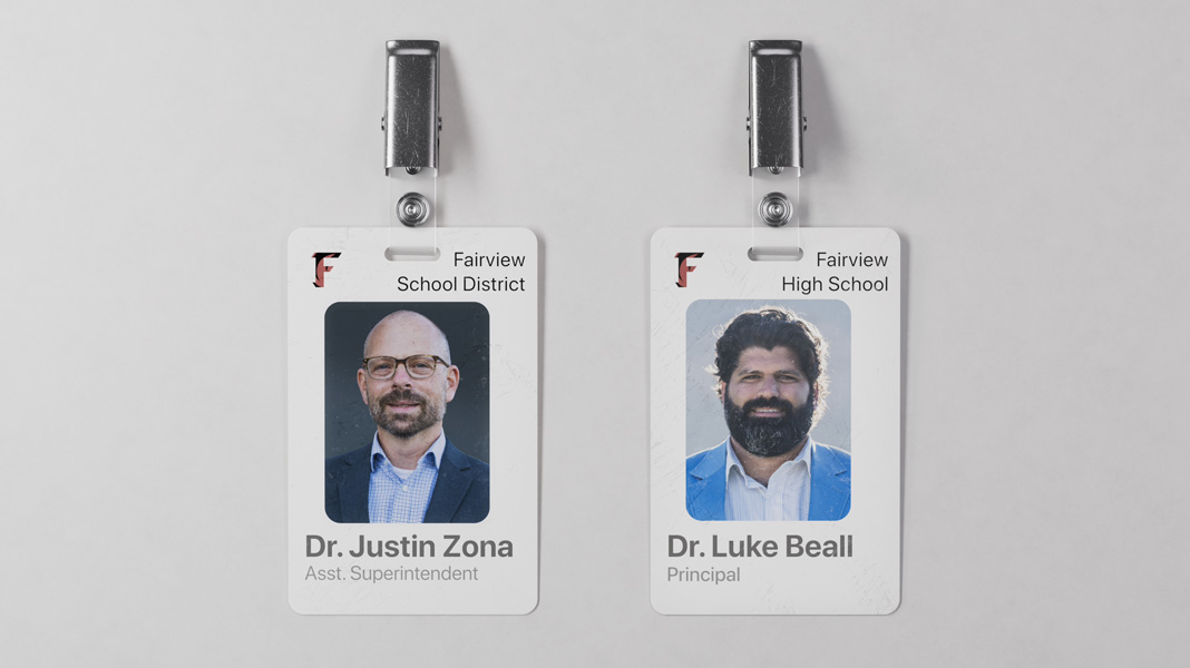 Two Fairview School District teacher name tags placed side by side, with Dr Justin Zona’s on the left and Dr Luke Beall’s on the right.