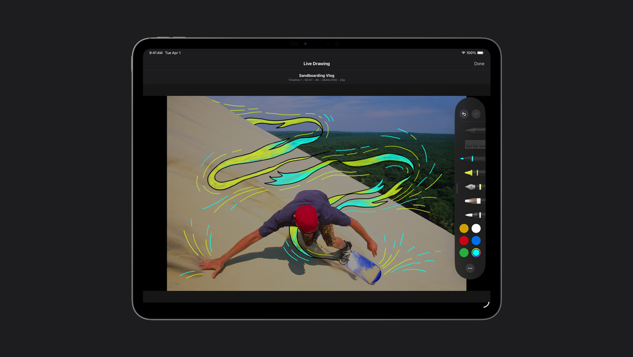 iPad Pro de 13 pulgadas, skater sobre dunas con líneas de movimiento amarillas y azules a su alrededor, demostración de Dibujo en Tiempo Real