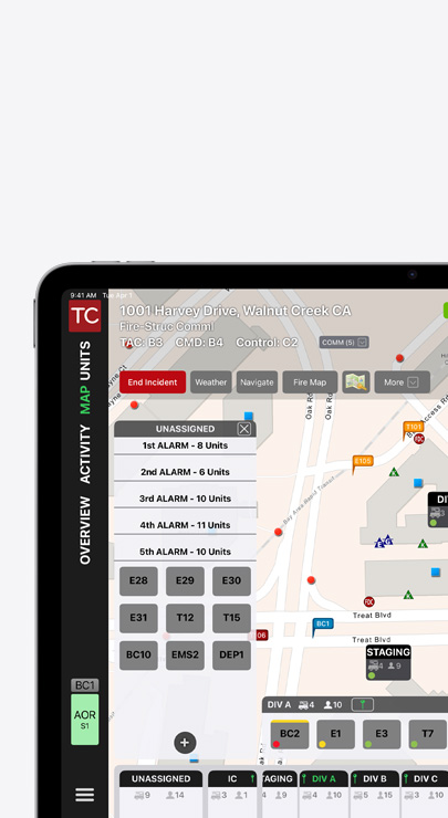 An iPad shows an incident command interface with a community map of roads and buildings, plus emergency alarm assignments.