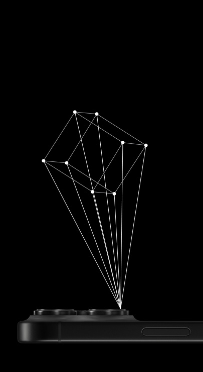 An iPhone lies face down with an outline of a 3D cube projecting from the iPhone’s LiDAR scanner