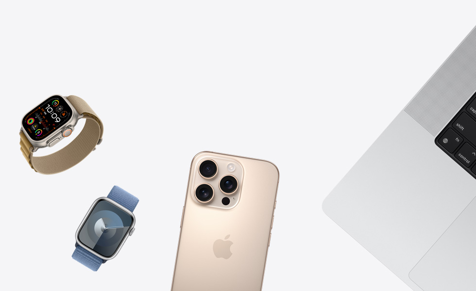Various products in a scattered array, including Apple Watch in Natural with Tan Alpine Loop Band, Apple Watch in Silver with Periwinkle Sport Loop Band, iPhone in Desert Titanium and MacBook in Silver