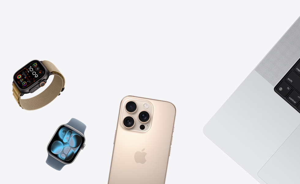 各式各樣的產品分散排列，包括原色 Apple Watch 搭配小麥色高山錶環、銀色 Apple Watch 搭配長春花色運動型錶環、沙漠色鈦金屬 iPhone，以及銀色 MacBook
