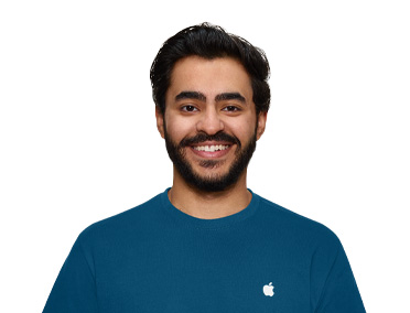 Apple Specialist smiling with an approachable demeanor