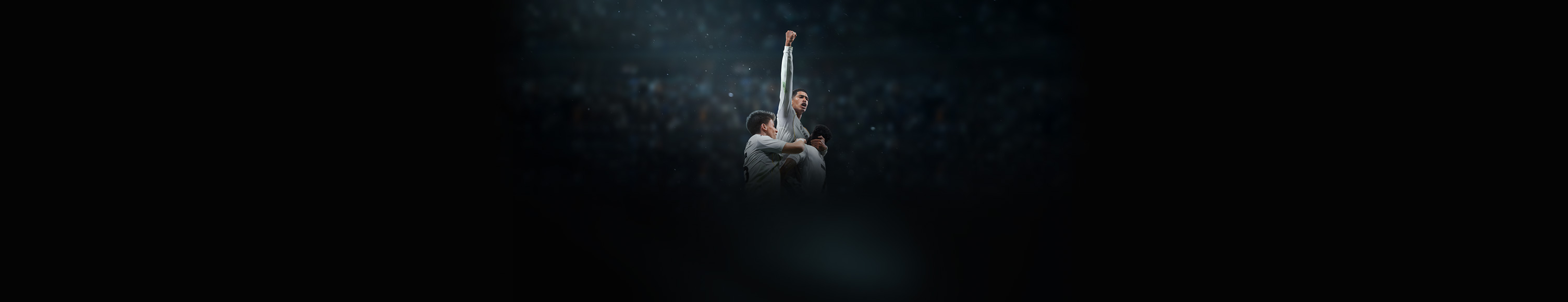 Apple Immersive promo, title: Real Madrid, The Weight of Greatness, Arda Guler and Vinicius Junior, holding up Jude Bellingham, who's lifting his arm up in celebration, dark blue background