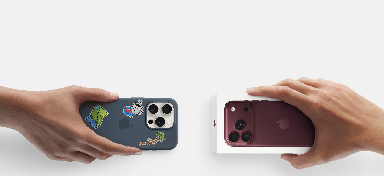 Side-by-side, hand holding iPhone 13 in silicon case with stickers on back exterior, trade-in with hand holding new iPhone box for iPhone 17 Pro