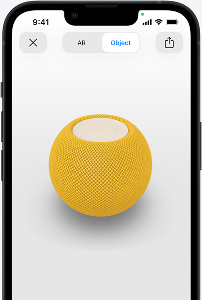 HomePod jaune en réalité augmentée sur l’écran d’un iPhone.