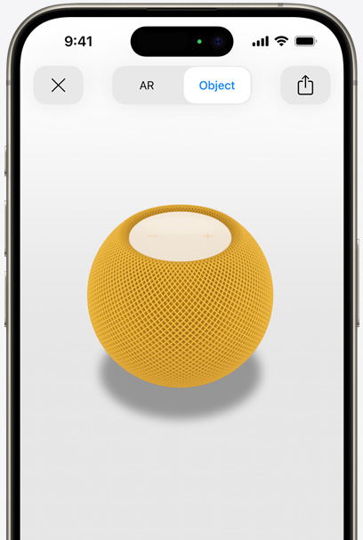 Gele HomePod in de AR-weergave op het scherm van een iPhone.