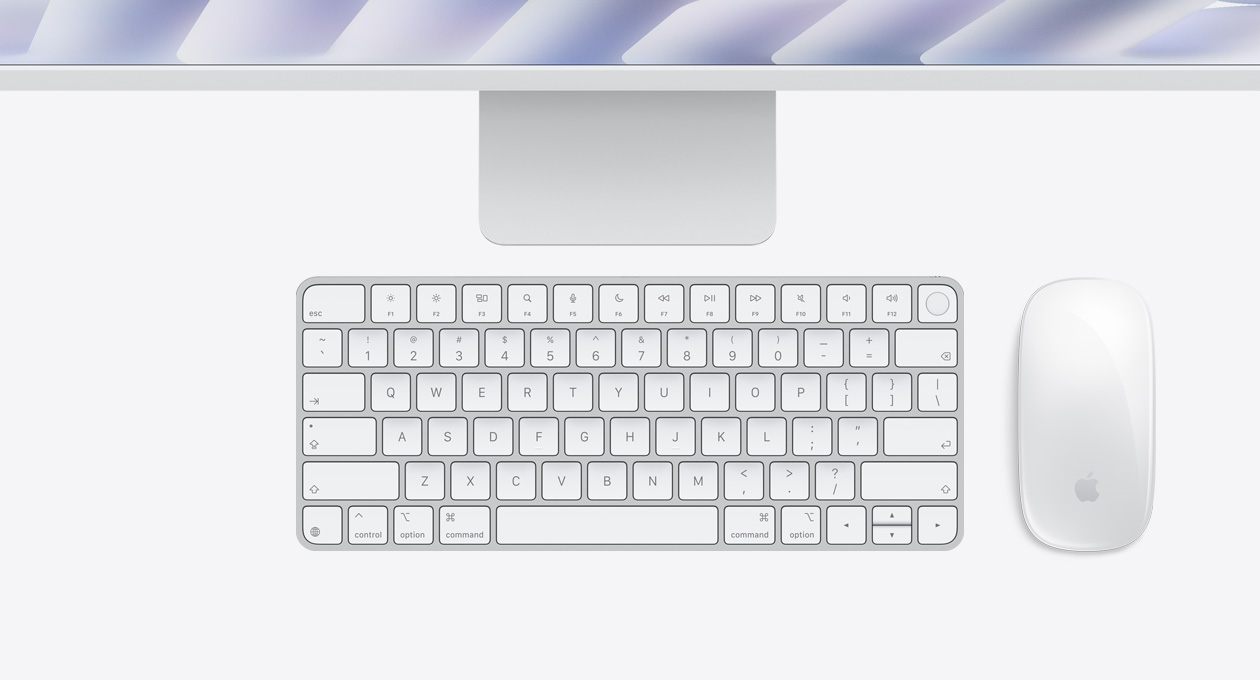Parte de cima externa do iMac prateado com Magic Mouse e Magic Keyboard com Touch ID