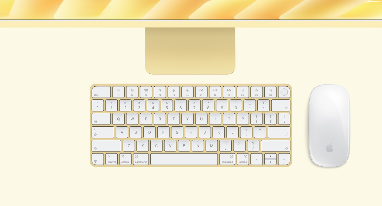 Parte de cima externa do iMac amarelo com Magic Mouse e Magic Keyboard com Touch ID