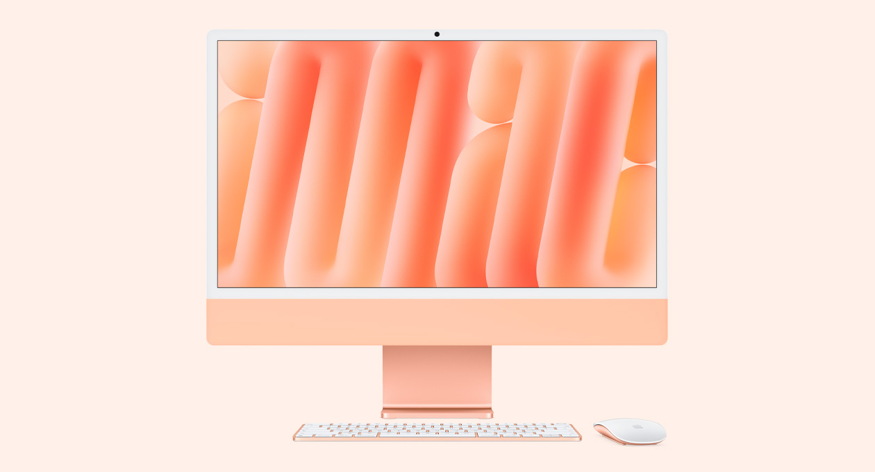 Parte da frente do iMac na cor laranja com Magic Mouse e Magic Keyboard na mesma cor