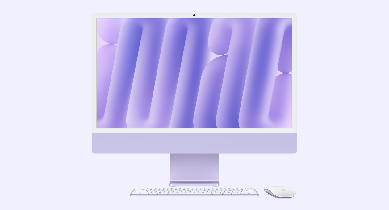 Parte da frente do iMac roxo com Magic Mouse e Magic Keyboard na mesma cor