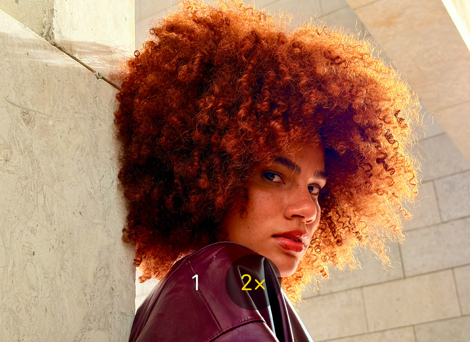 Photo of a person taken with 2x Telephoto camera feature